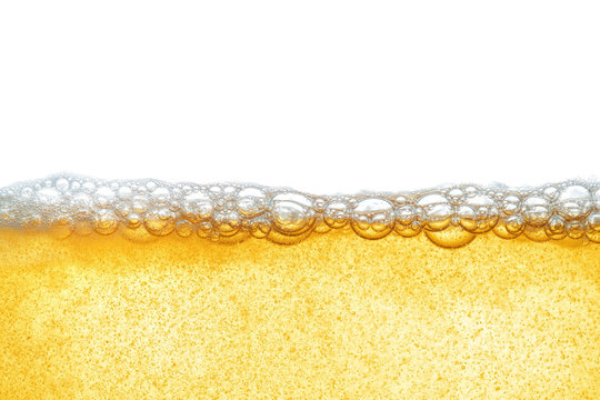 Yellow liquid with beer foam, or industrial oil. Human fat obesity. Close-up.
