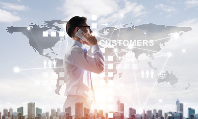 Concept of business success and control with confident boss against cityscape background