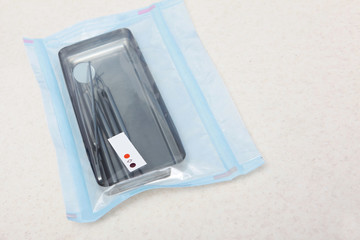 Packed dental items with markers on the package. Concept of sterilization and disinfection in the...