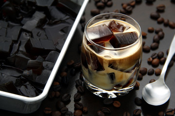 Coffee flavored jelly with milk in a glass