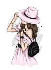 Beautiful girl in a stylish summer dress and hat. Vector illustration for poster, print on clothes. Fashion & Style.  - 346155886