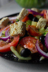 salad on a black plate. diet salad.