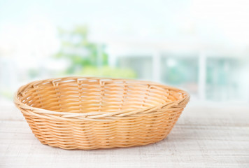 Fototapeta na wymiar Wicker basket on a white wooden table