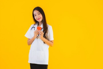 Portrait beautiful young asian doctor woman show heart for symbol of love