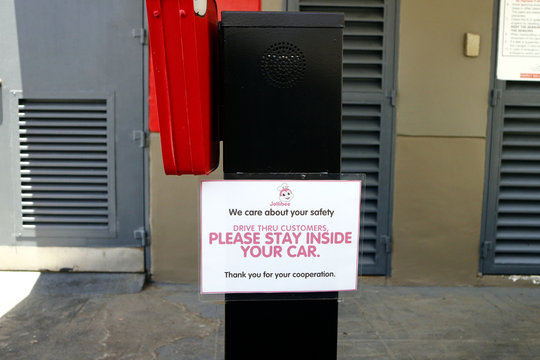 Signage At The Drive Thru Facility Of A Fast Food Restaurant During The Covid 19 Virus Outbreak