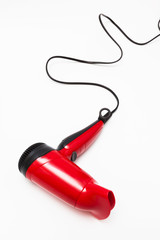 Obraz premium beautiful red hair dryer on white background