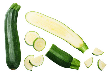 fresh green zucchini with slices isolated on white background. top view