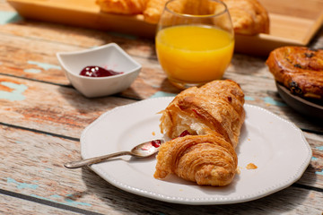 Continental Breakfast With Croissants on Rustic Table