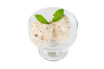 Ice cream with walnuts in glass bowl on a white isolated background