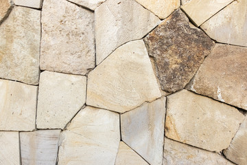 Part of the stone walls of gray-beige color for a background or texture.