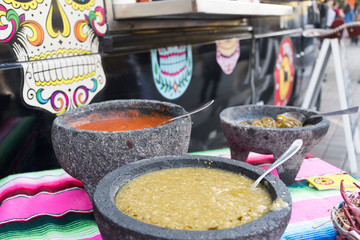 Spiced red tomato salsa and spiced green salsa for seasoning traditional Mexican food