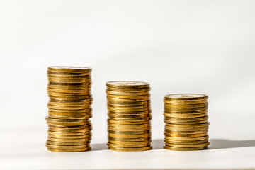 Money. Columns with coins close-up stand on a white background. All money is new Israeli shekels.