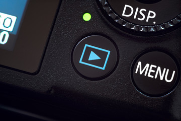 Playback button on camera. Playback button in close up. 