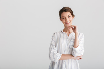 Image of cheerful nice woman smiling and winking on camera