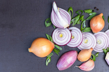 close up of various of onions in pink, white, green for cooking isolated on black background with space.