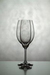 Two glasses for wine. One for champagne and one for wine on a light background.