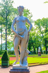 Marble statue of muse of lyric poetry Euterpe in old city park Summer Garden in St. Petersburg,...