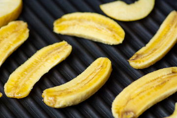 Sliced bananas on the grill
