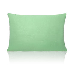 Green pillow with a small relief pattern isolated on a white background with reflection