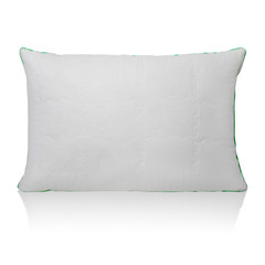 White pillow with a small relief pattern isolated on a white background with reflection
