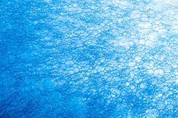 Obraz premium Blue Soap Bubbles - Water Abstract Macro Foam Background,Abstract soap foam bubbles , Photos Texture of blue soap foam closeup 