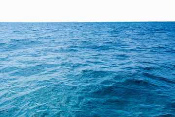 Surface blue sea water. Texture of water with small waves 

