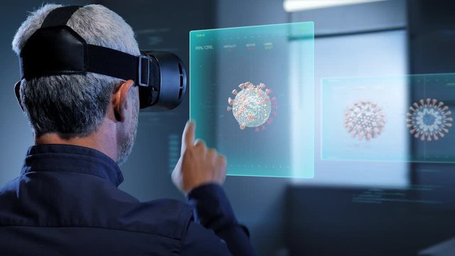augmented reality,virologist scientist with vr glasses headset looking at  coronavirus covid 19 graphics charts showing data about the virus infection on human body
