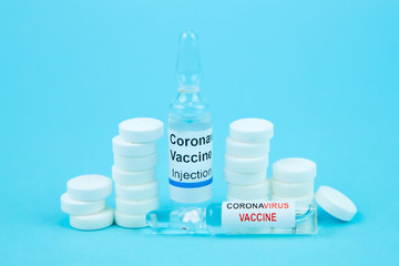 coronavirus vaccine testing. Vials with medicines, pills, syringes, thermometer, medical mask on a...