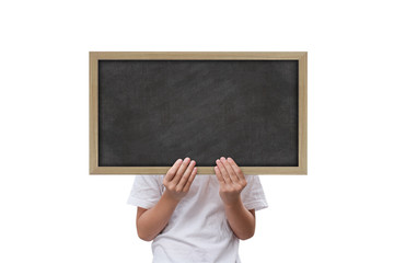 Little girl show black board isolated on black background. with clipping path