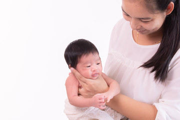 Beautiful young Asian mother hold tiny adorable newborn baby girl 0-1 month with her hand to help baby belch or Making burp after feeding with caring and love, lifestyle health care newborn at home