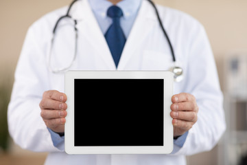 Doctor holding tablet with black blank screen