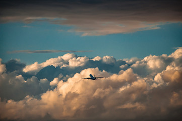 Airplane take off at sunset.