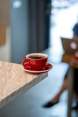 Black filter coffee on the table in cafe glass cup hario pour over cup side