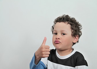 boy showing thumbs up on white background stock photo
