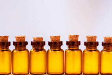 Defocused photo of amber-colored pharmaceutical vials. Copy space