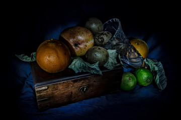 still life with wooden box and crystal vase