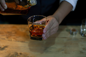 Bartender Serve Whiskey, on wood bar,