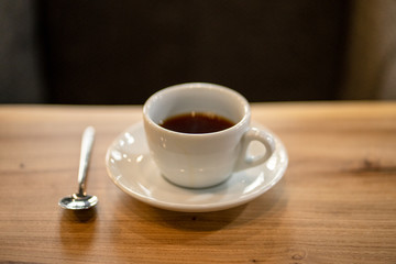 Black filter coffee on the table in cafe glass cup hario pour over cup side