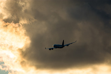 Airplane take off at sunset.