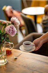 Black filter coffee on the table in cafe glass cup hario pour over cup side
