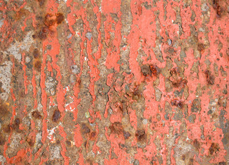Surface with  remains of old paint for backdrop. Color Light Coral. Rust stains.