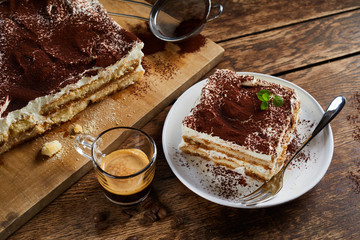 Cut portion of freshly made Italian tiramisu