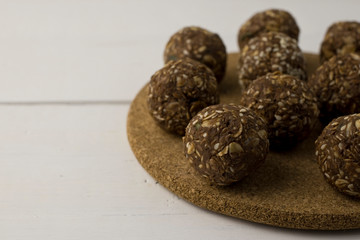 Oat and nut home made energy balls on a white table