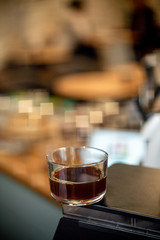 Black filter coffee on the table in cafe glass cup hario pour over cup side