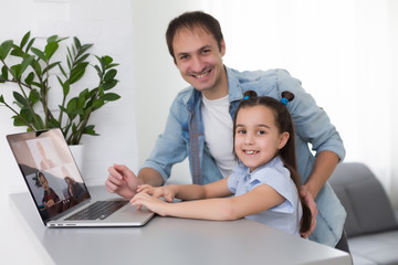 Coronavirus concept. father and daughter learning from home