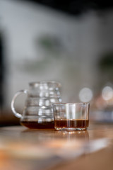 Black filter coffee on the table in cafe service kettle hario pour over cup