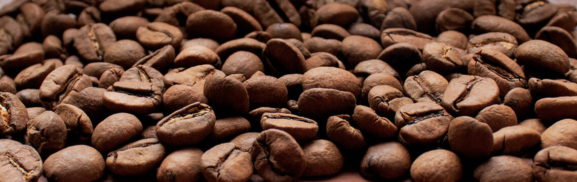 coffee beans background. the texture of the coffee. solid background of coffee beans. the technique of brewing coffee.coffee beans. background for coffee shops.