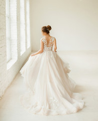 bride in white wedding dress. happy beautiful young woman in white traditional wedding dress on...