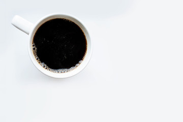 coffee top view. black coffee on a white background. coffee in a white mug.