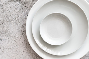white color Plain dinner plate on stone table top view